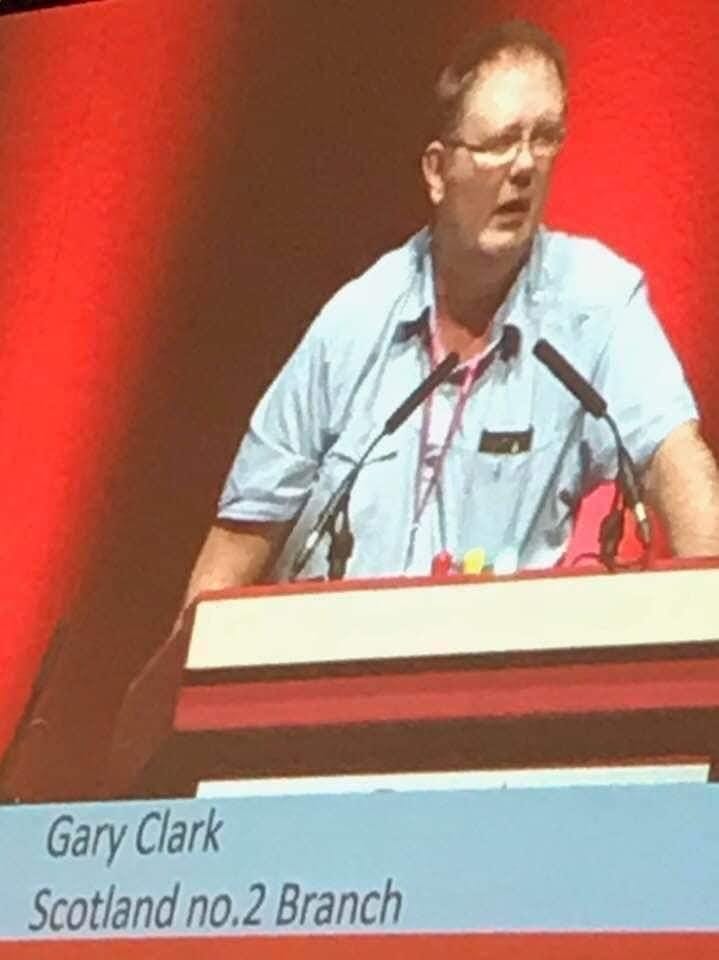 Gary speaking from a conference lectern labelled Scotland No.2 Branch