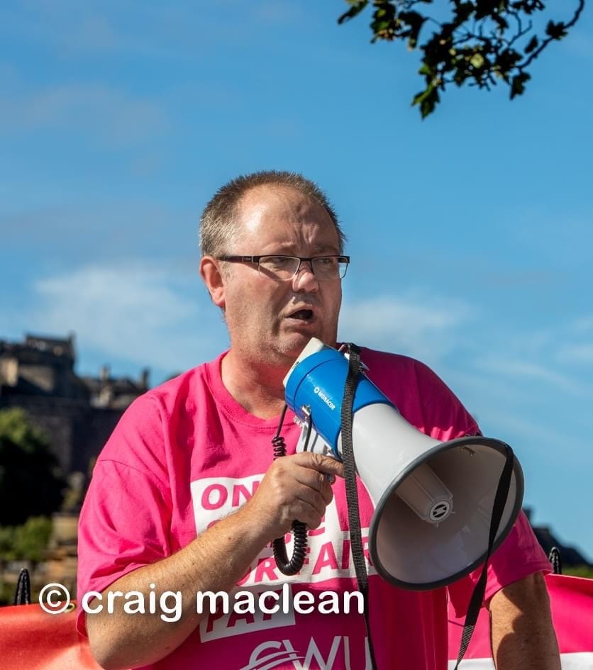 Gary Clark addressing a gathering with a megaphone